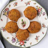 Falafel · 4 pieces. Fried ball made from beans.