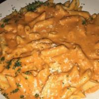 Penne Alla Vodka · Penne pasta tossed in a pink vodka sauce. This dish contains prosciutto.