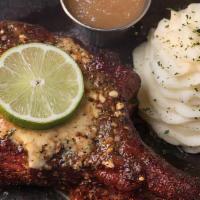 Friday Lunch Pork Chop | Gf · Perry's famous pork chop, slow smoked and caramelized. Served with apple sauce and whipped p...