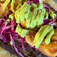 Baja Shrimp · Grilled shrimp in a flour tortilla, bean purée, red cabbage, chipotle may and avocado puree.