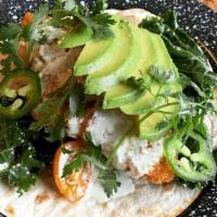 Fish Taco · Crispy cod in flour tortilla, kale & tomato salad, avocado, cilantro, jalapeño, and jalapeño...