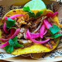 Cochinita · Pulled pork with pickled onions. Gluten free.