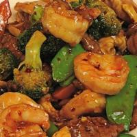 Triple Delight · Sliced beef, chicken and jumbo shrimp sautéed with Chinese vegetables in brown sauce.