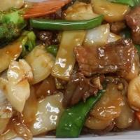 Beef With Scallops · Sliced tender beef & fresh sea scallops sautéed with water chestnuts, snow pea pods, straw m...