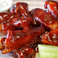 10 - On The Bone Wings · Deep-fried chicken wings with your choice of sauce.