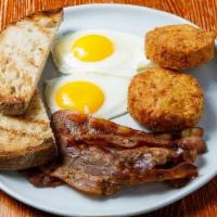 Eggs Your Way · Two eggs, choice of applewood smoked bacon or sausage, toasted country bread, hash browns