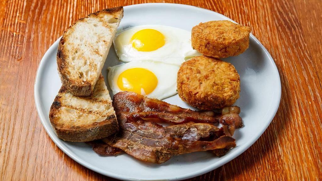 Eggs Your Way · Two eggs, choice of applewood smoked bacon or sausage, toasted country bread, hash browns