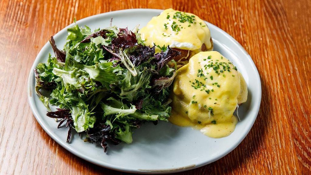 Eggs Benedict  · Two poached eggs, Canadian bacon, English muffin, hollandaise, organic mixed greens