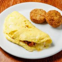 Four Richmond Omelette  · Bacon, tomato, cheddar cheese, hash browns or mixed organic greens