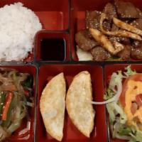 Lunch Combo Boxes · All lunch combos served with white rice, two mandu dumplings, small house salad, and a side ...