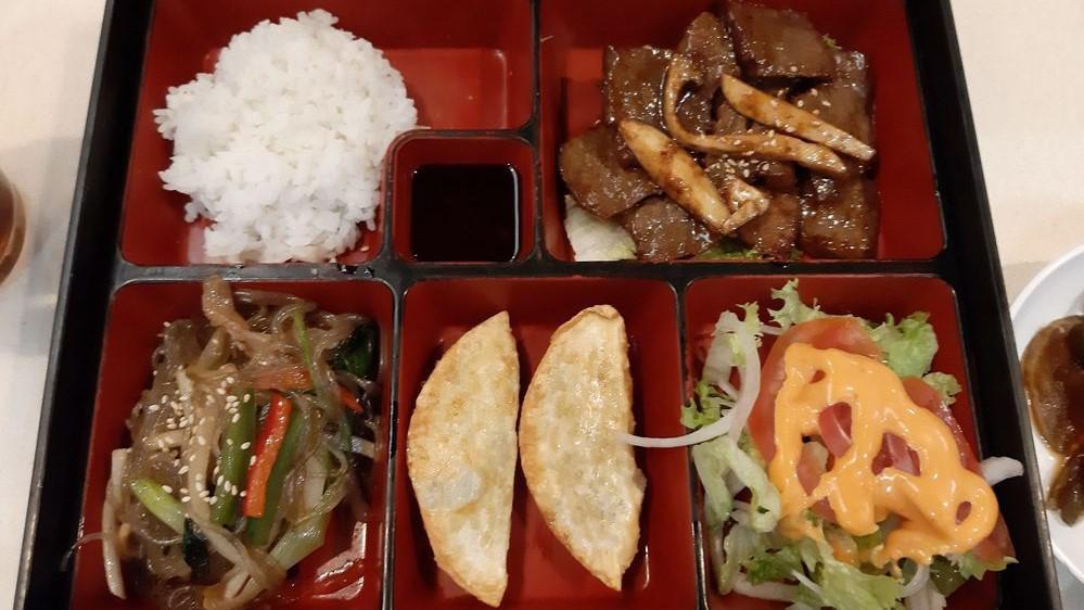 Lunch Combo Boxes · All lunch combos served with white rice, two mandu dumplings, small house salad, and a side of jap chae noodles. Choice of BBQ or protein.