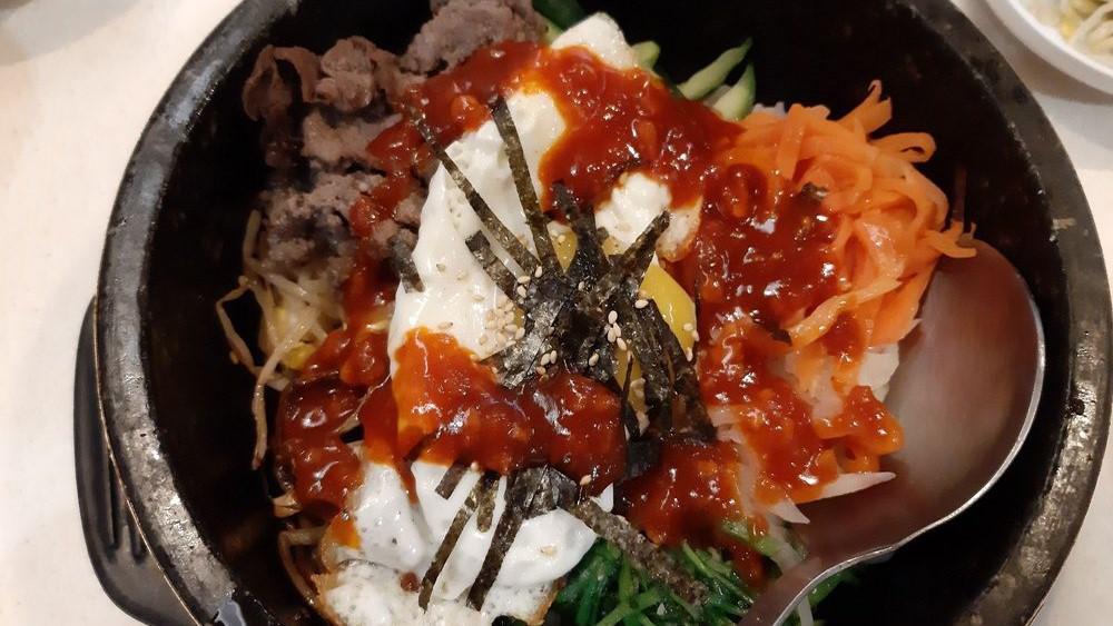 Bibimbap · Gluten-free, vegetarian, spicy. Lightly seasoned mixed vegetables, ground beef, fried egg over rice. Served with miso soup & spicy gochujang red pepper sauce.