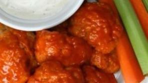 Hot Buffalo Cauliflower Bites · Served with celery or carrots, and blue cheese or ranch.