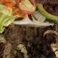 Carne Asada (Grilled Steak) · Salad, rice, refried beans, two homemade tortillas, and cheese.