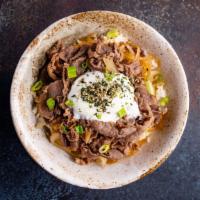 Gyu Don · Beef and Onions served with sweet and savory sauce and poached egg.