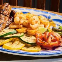 Shrimp Mojo · Shrimp with MexiScampi Sauce and mexican sausage served with zucchini, squash, tomato, and j...