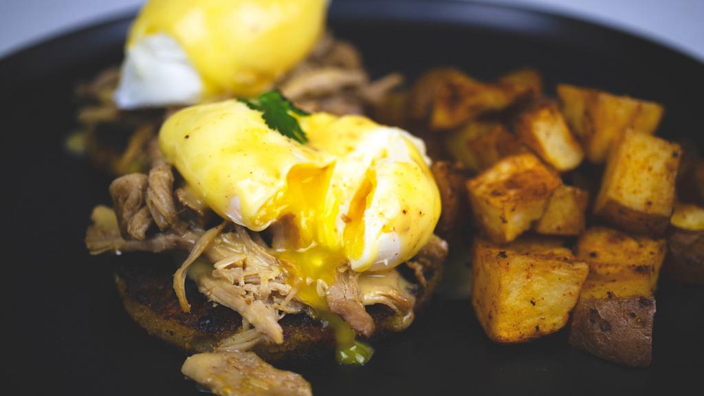 Arizona Benedict · Corn biscuit, slow roasted pork, poached eggs, jalapeno hollandaise, choice of side.