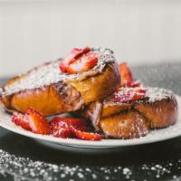 Brioche French Toast · Berries, powdered sugar, 100% pure maple syrup.