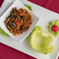 Chicken In Crisp Lettuce Wraps · Chicken sauteed w. Sweet basil red and green peppers, garlic onion and crisp lettuce.