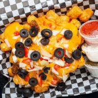 Loaded Totchos (Tatertot Nachos) · Tots covered in seasoned ground beef, Nacho cheese, olives, tomatoes, onions plus jalapenos,...