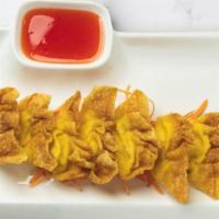 Cream Cheese Wonton · Wonton skin stuffed with cream cheese and deep-fried. Served with sweet and sour chili sauce.