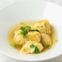 Wonton Soup · Dumplings stuffed with chicken seasoned with soy sauce and herbs, gently simmered in clear c...