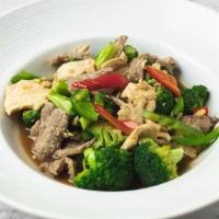 Broccoli Stir Fry · Sauteed broccoli, bell pepper, and garlic in light brown sauce. Served with steamed jasmine ...