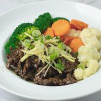 Sizzling Beef · Marinated flank steak in our exotic brown sauce, topped with ginger and toasted sesame seed....