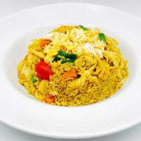 Yellow Curry Fried Rice · Thai jasmine rice stir-fried with yellow curry, eggs, onions, scallion, carrot, pea, and tom...