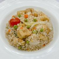 Vegan Thai Fried Rice (No Egg) · Thai jasmine rice stir-fried with onions, scallion, carrot, pea, and tomatoes.
