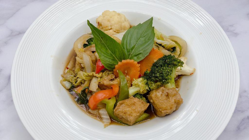 Vegan Ka Praw - Thai Basil Stir Fry · Savory, spicy, redolent of garlic, chili, and fresh basil sauce that is just lightly caramelized with onion and bell pepper. Served with steamed jasmine rice.