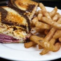 Reuben · Corned beef slow cooked in Guinness Stout, topped with saurkraut, Swiss cheese, and Russian ...