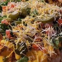 Phoenix Nachos · Tortilla chips topped with queso cheese, house-made chili, jalapeños, pico de gallo, and shr...