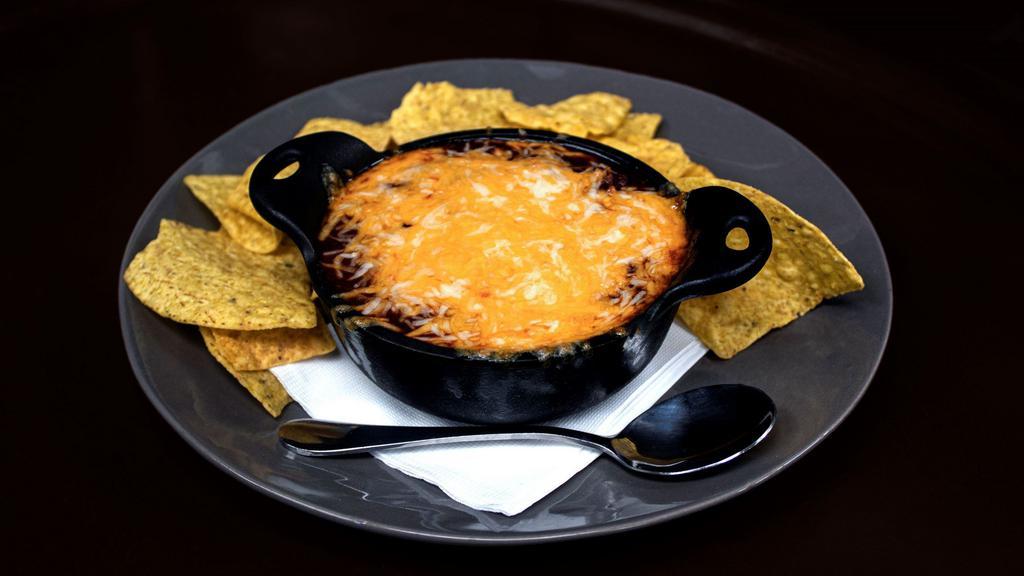 Phoenix Chili · Our classic chili made with local ground beef, onions, and peppers, topped with melted cheese and served with tortilla chips and sour cream
