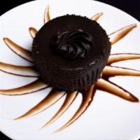 Chocolate Velvet Cheesecake · Creamy cheesecake covered in chocolate ganache