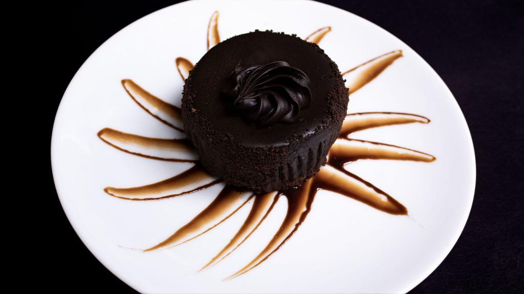 Chocolate Velvet Cheesecake · Creamy cheesecake covered in chocolate ganache