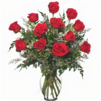 Classic Dozen Roses Red Rose Arrangement · Classic Urn Vase  Foliage: Leather Leaf, Myrtle   Red Roses   Misty Blue Limonium.

This vas...