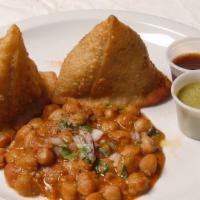 Samosa · Two fried pastry shells stuffed with roasted cumin, potatoes served with mint and tamarind s...