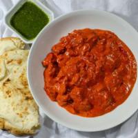 Butter Chicken · Dark meat tandoori chicken in tomato sauce with cinnamon, cloves, cardamom and bay leaves.