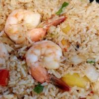 Pineapple Fried Rice · Fried rice with chicken, shrimp, pineapples, onions, scallions, tomatoes, egg, and cashew nu...