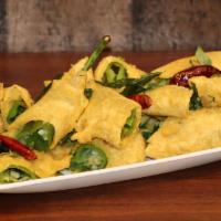 Cut Mirchi · Long green chilies, dipped in a chickpea and rice flour batter and double fried. An excellen...