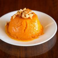 Mango Kesari · Sooji (sweet cream of wheat), cooked with mango pulp and topped with nuts.