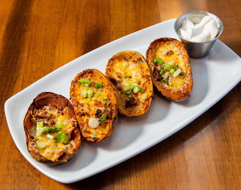 Potato Skins · Gluten free. Applewood smoked bacon, Cheddar cheese, scallions and sour cream.