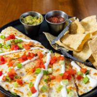 Fire Grilled Quesadilla · Served with salsa, tomatoes, sour cream, scallions and guacamole served with chips and salsa.