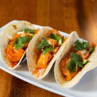 Pow Pow Shrimp Tacos · Grilled shrimp tossed in pow pow sauce with pickled carrot and daikon radish, sriracha mayon...