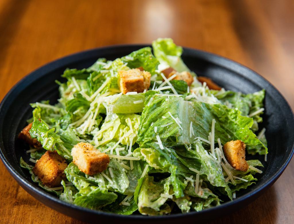 Classic Caesar Bowl · Chopped romaine hearts, garlic croutons and Parmigiano-Reggiano tossed with our crafted dressing.
