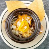 Chili · A spicy meat, bean, Narragansett beer, cheese and coriander award-winning chili over a bed o...