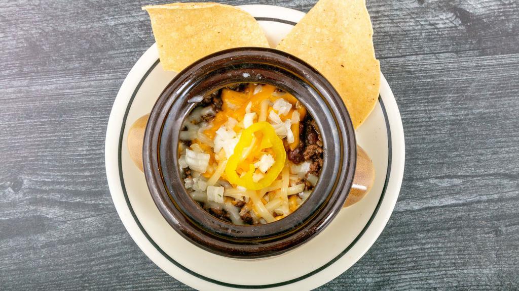 Chili · A spicy meat, bean, Narragansett beer, cheese and coriander award-winning chili over a bed of fritos.
