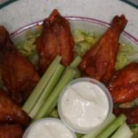 Boneless Buffalo Wings · Four mild, hot or suicidal wings served with celery sticks & blue cheese.