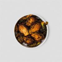 Side Crispy Brussel Sprouts · Deep fried and tossed in our sweet and spicy dry rub.. Allergens: soy